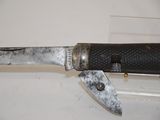 a knife that is laying on a counter
