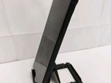 a cell phone that is sitting on top of a stand