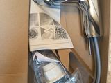 a box with a hair dryer and a bottle of water in it