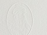 a close up of a white business card with an image of a woman ' s face