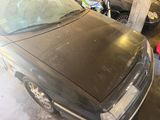 a black car that is parked in a garage