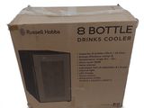 packaging of a bottle cooler sitting on top of a cardboard box