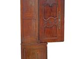 a wooden cabinet with a door open on a white background