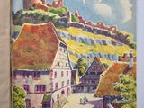 un vieux livre avec une image de château en arrière-plan