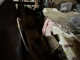 a room with a lot of clutter and junk on the floor