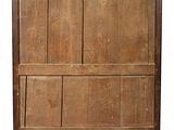 an old wooden cabinet with two doors and a drawer underneath it