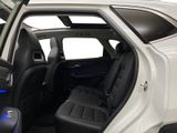 the interior of a white suv with black seats and a blue light