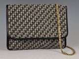 a black and white bag with a gold chain strap