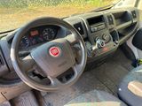a dashboard of a car with a steering wheel and dashboard controls