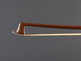 a close up of a violin bow with a wooden handle