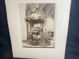 an old black and white photo of a statue in a church