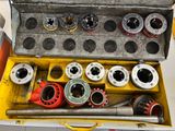 a tool box filled with various tools sitting on a table