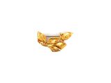 a close up of a gold leaf brooch on a white background