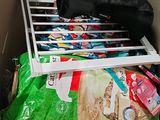 a pile of food in a cardboard box with a bag of cat food