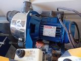 a picture of a blue and silver pump on a table