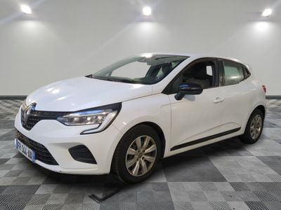 a white car parked in a room with a checkered floor
