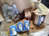 several boxes of light bulbs sitting on top of a table