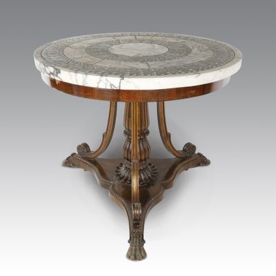 an antique marble top table with a wooden base