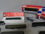 many different types of toy trains sitting on a table