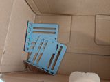 a cardboard box with a chair in it and a mouse in it