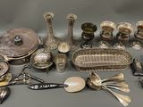 a lot of silver items that are on the table