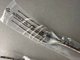 three forks in a plastic bag on a table
