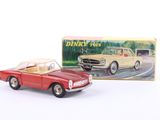 a toy car that is sitting next to a box