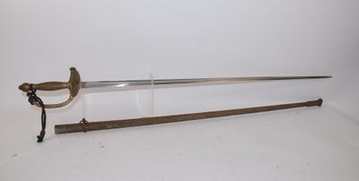 un gros plan d'une épée sur une surface blanche avec un fond blanc