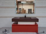 a picture of a bathroom sink with a mirror above it