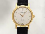 an image of a gold plated wrist watch with a white dial