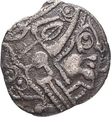 a silver coin with a horse and rider on it