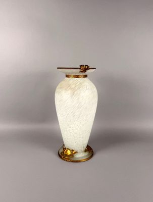 an image of a white vase with a gold handle