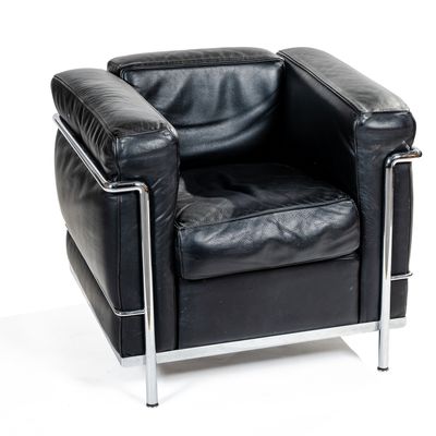 a black leather chair with chrome legs and a black leather seat