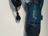a cord that is connected to a drill on a table