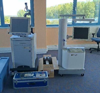 a room with a computer, printer, and other equipment in it