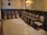 a room with a lot of chairs and tables in it