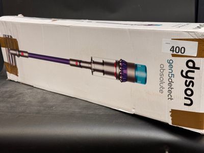 boxed box of a vacuum cleaner sitting on top of a table