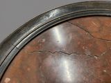 a close up of a metal object with a crack in it