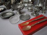 a table with silverware and silverware on it