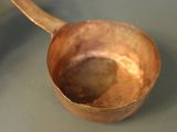 a wooden spoon that is sitting on a table