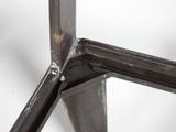 a close up of a piece of metal with a hole in it