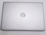 hp laptop computer sitting on a white surface with a logo on it