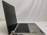 an open laptop computer sitting on top of a white surface