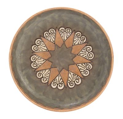 a plate with a star design on it on a white background