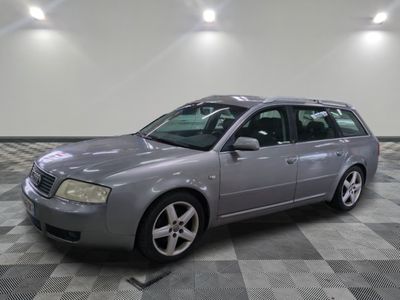 a picture of a silver car parked in a garage