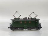 a green train car with people on top of it