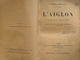 a book opened to show the title of a novel
