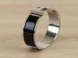 a picture of a ring with a cross on it