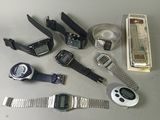 a lot of electronic watches that are on the table