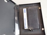 a metal box with a book inside of it